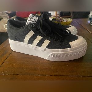 Brand new platform adidas.  Black and white. Size 8 women’s.